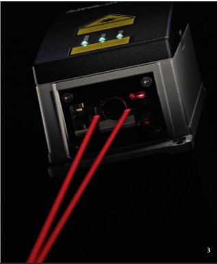 Close-up of Polytec laser Doppler measurement optics with dual red beams